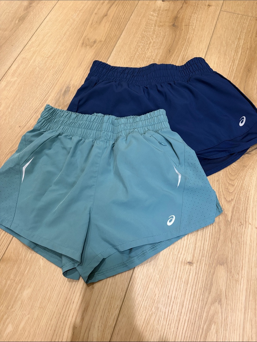 Two like new asics running shorts
